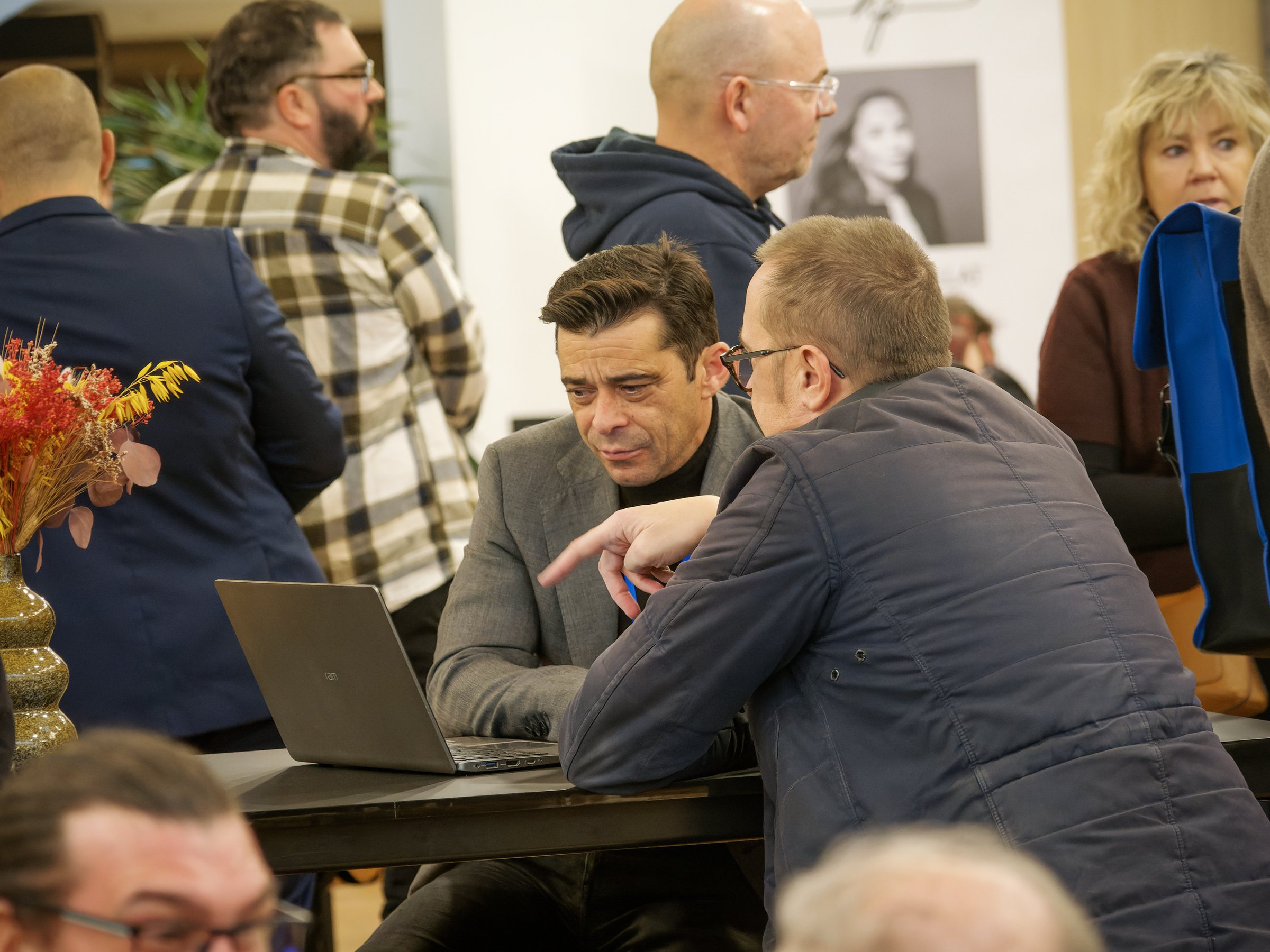 An advisor meets a client at a property fair