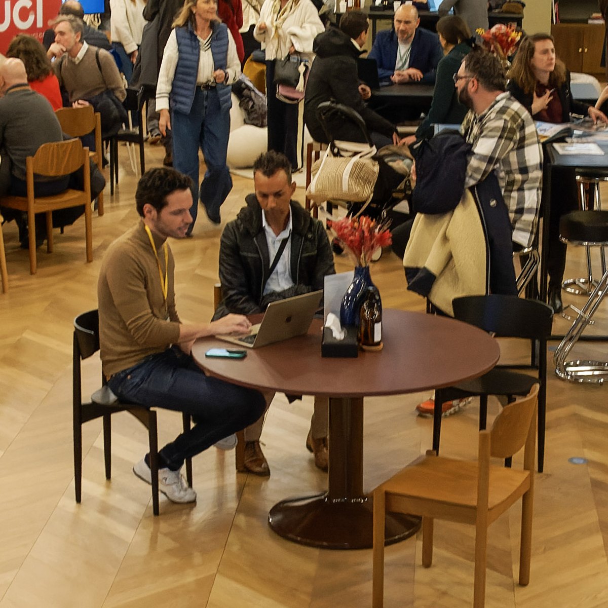 Professionals meeting at a table at the property fair
